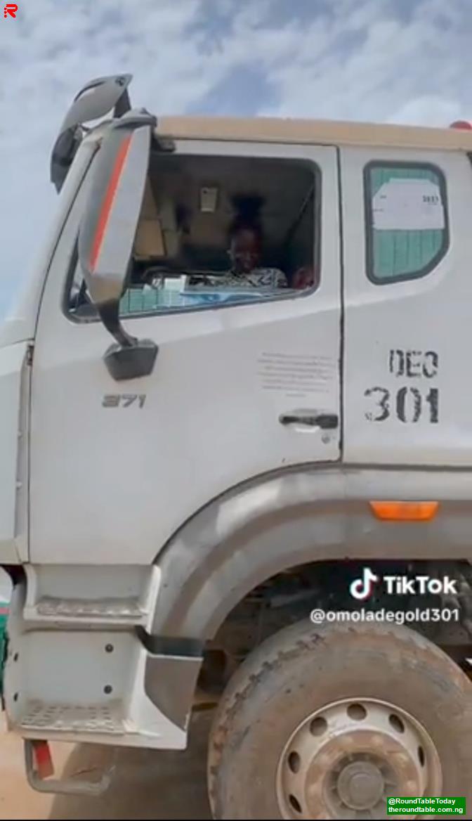 A small girl driving truck