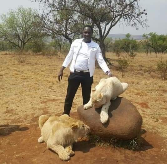 Another Nigerian Pastor Poses With Lions, Sells Oil for Bearing Twins